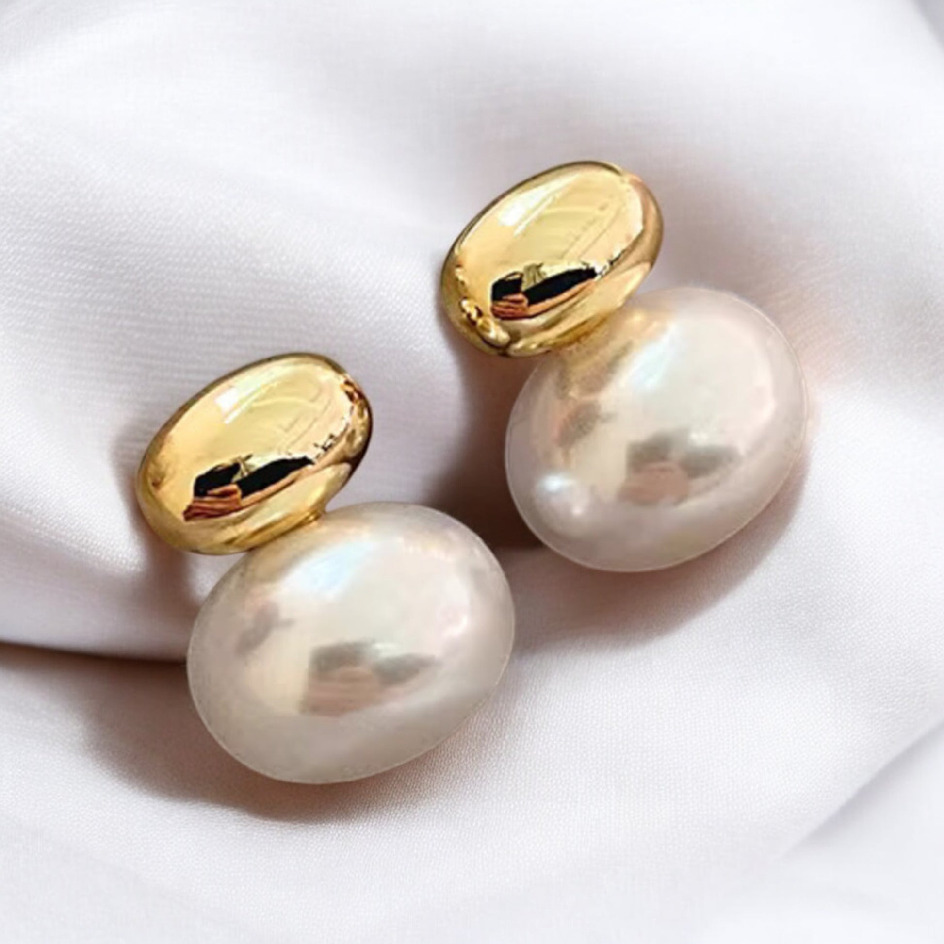 Luxe French Gold and Pearl Accent Earrings_Lifeluxe jewelry trending beautiful_Indulge in pure luxury with these stunning Luxe French Gold and Pearl Accent Earrings. The combination of classic flat pearls and a modern gold splice design creates an accessory that will elevate any outfit for any occasion.