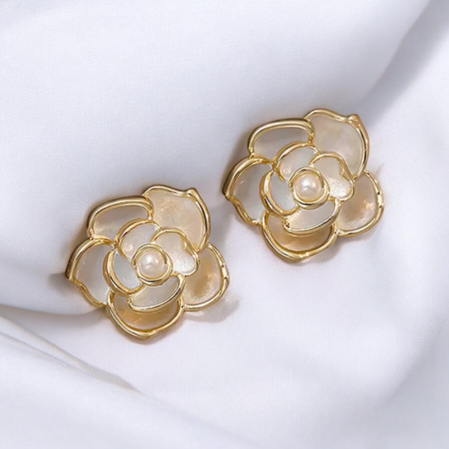 Parisian Camellia Enamel Studs _Lifeluxe jewelry trending beautiful
Step into the world of French romance with these stunning Parisian Camellia Enamel Studs. Perfect for the modern woman who appreciates both elegance and sophistication, these earrings are a luxurious addition to any jewelry collection. Inspired by the delicate beauty of camellia flowers, they are designed to bring a touch of refined charm to your look.

Features:

Sophisticated Design: Features a beautifully crafted white enamel camellia fl